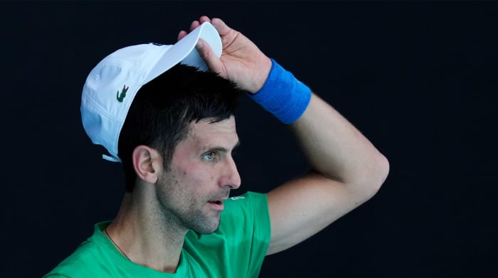 Defending men's champion Serbia's Novak Djokovic practices on Margaret Court Arena ahead of the Australian Open tennis championship in Melbourne, Australia, Thursday, Jan. 13, 2022.